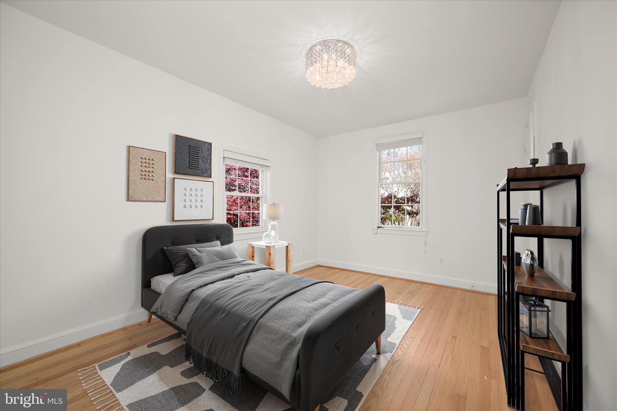 7012 Exeter Road Bethesda, MD 20814 - Photo 81 of 103 a bedroom with a bed and a bookshelf