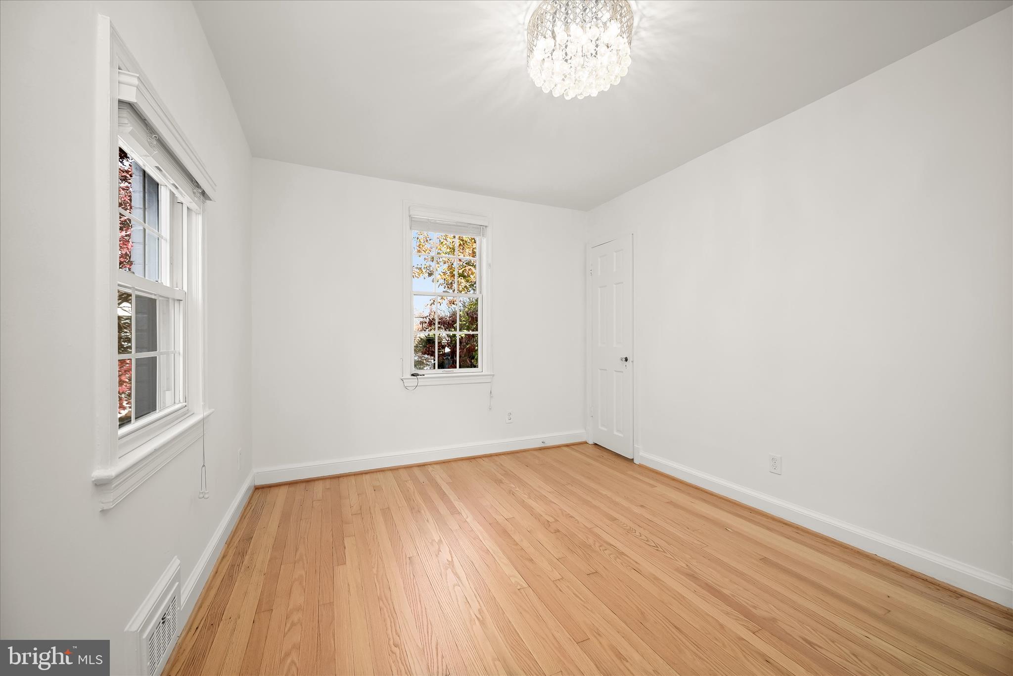 7012 Exeter Road Bethesda, MD 20814 - Photo 83 of 103 a view of empty room with wooden floor and fan