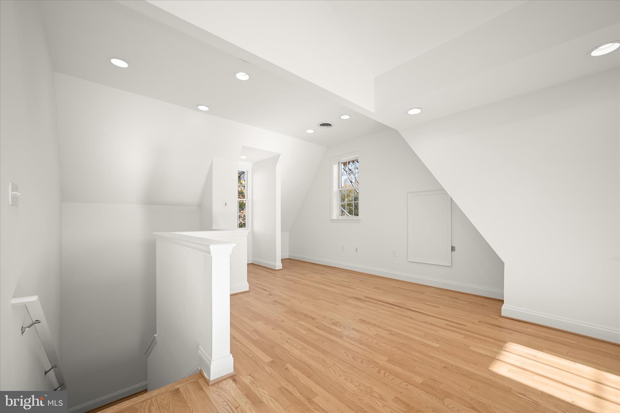 7012 Exeter Road Bethesda, MD 20814 - Photo 85 of 103 a view of a hallway with wooden floor and a bathroom