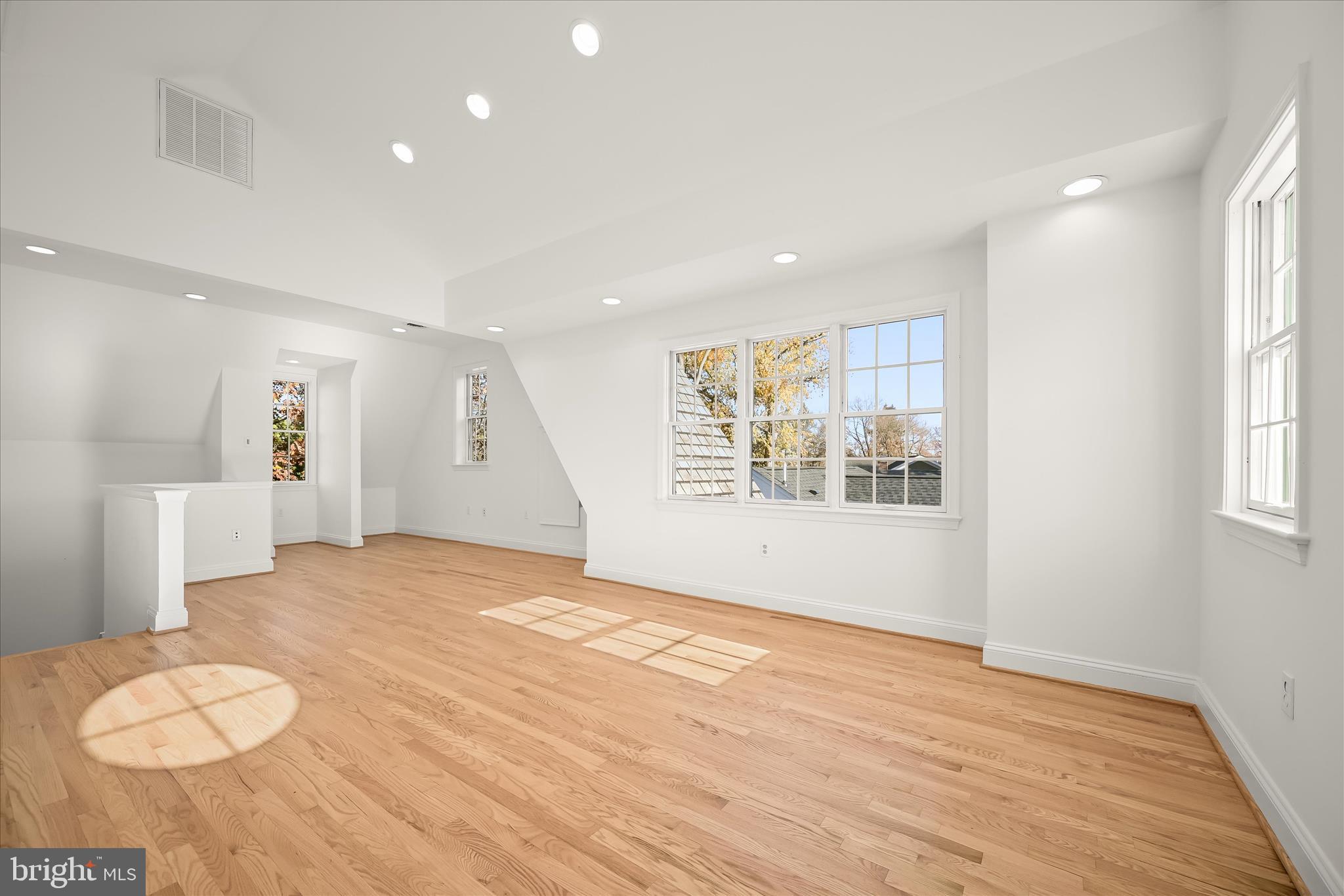 7012 Exeter Road Bethesda, MD 20814 - Photo 92 of 103 a view of an empty room with wooden floor and a window