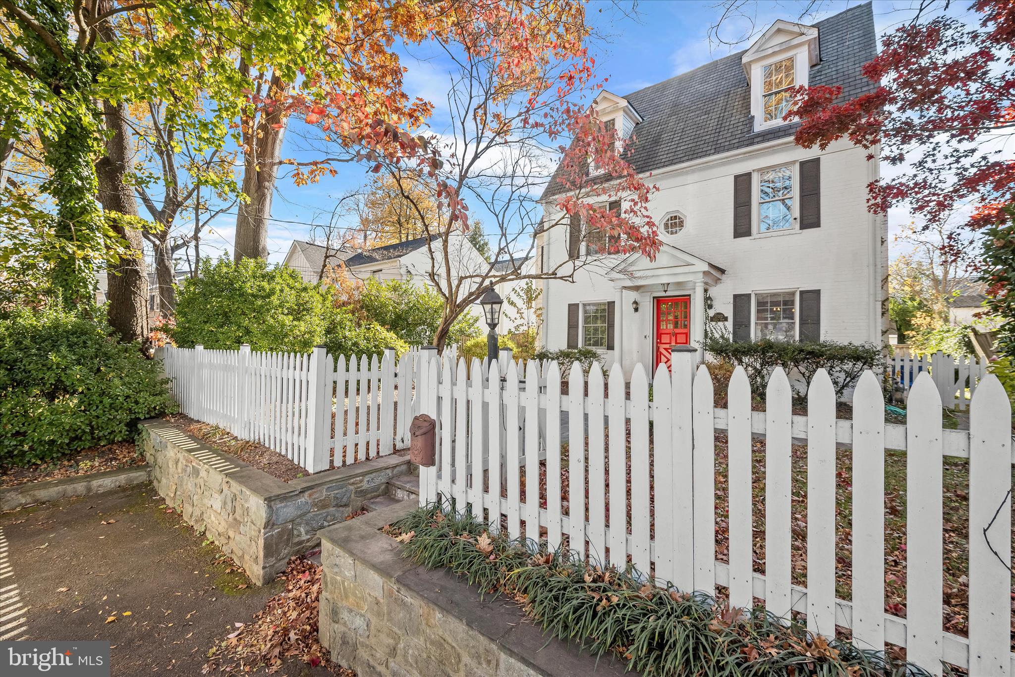 7012 Exeter Road Bethesda, MD 20814 - Photo 100 of 103 a front view of white house with a small yard