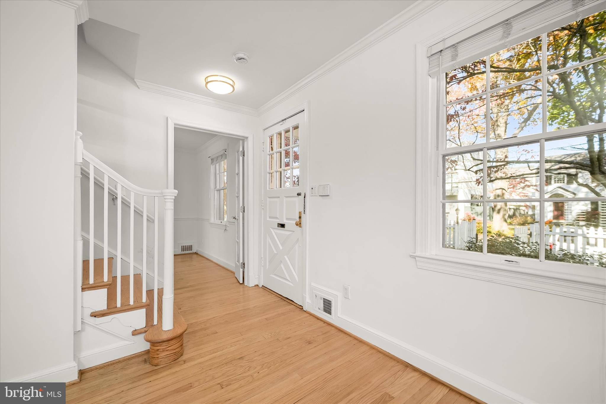 7012 Exeter Road Bethesda, MD 20814 - Photo 10 of 103 a view of empty room with wooden floor and fan