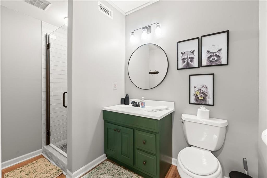 189 Frost Pine Circle Jasper, GA 30143 - Photo 11 of 42 a bathroom with a toilet sink and mirror