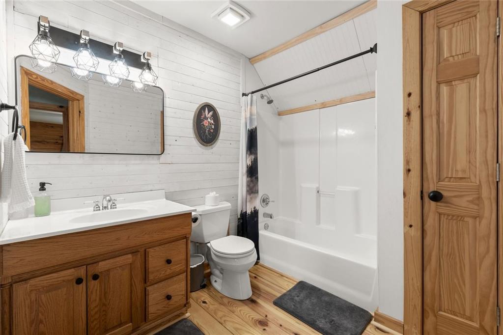 189 Frost Pine Circle Jasper, GA 30143 - Photo 19 of 42 a bathroom with a double vanity sink mirror and toilet