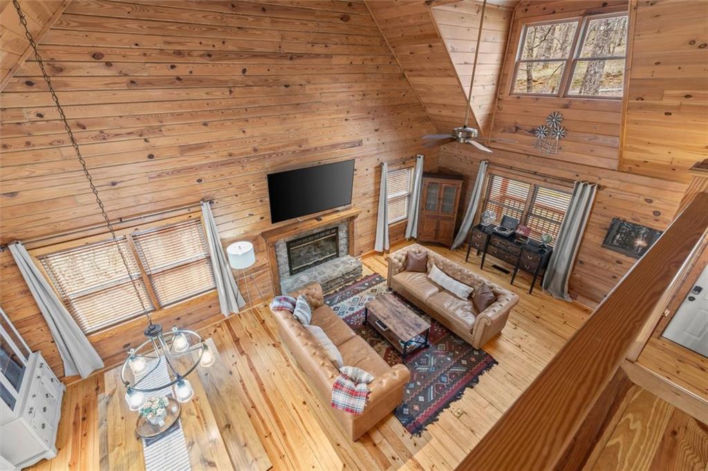 189 Frost Pine Circle Jasper, GA 30143 - Photo 20 of 42 a living room with furniture a flat screen tv and a fireplace