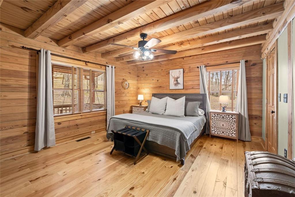 189 Frost Pine Circle Jasper, GA 30143 - Photo 23 of 42 a bedroom with a bed and wooden floor