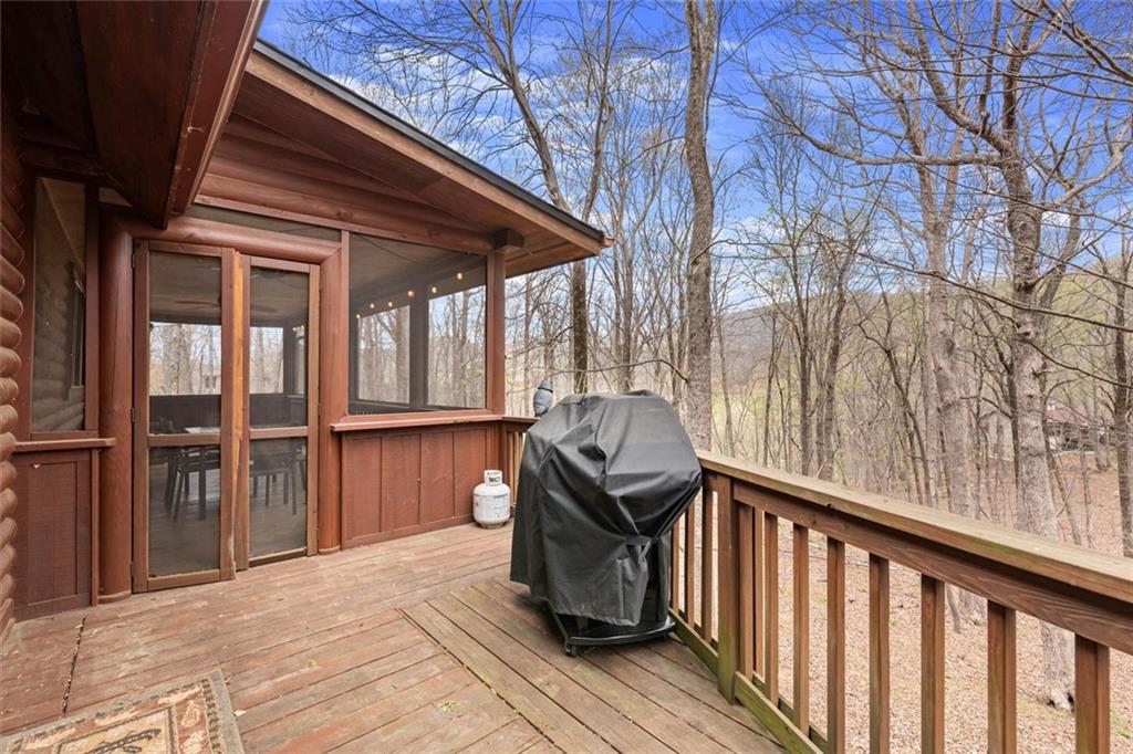 189 Frost Pine Circle Jasper, GA 30143 - Photo 26 of 42 a porch with seating space and hardwood floor