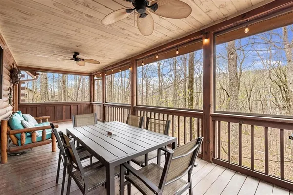a view of dining room with furniture window and wooden floor