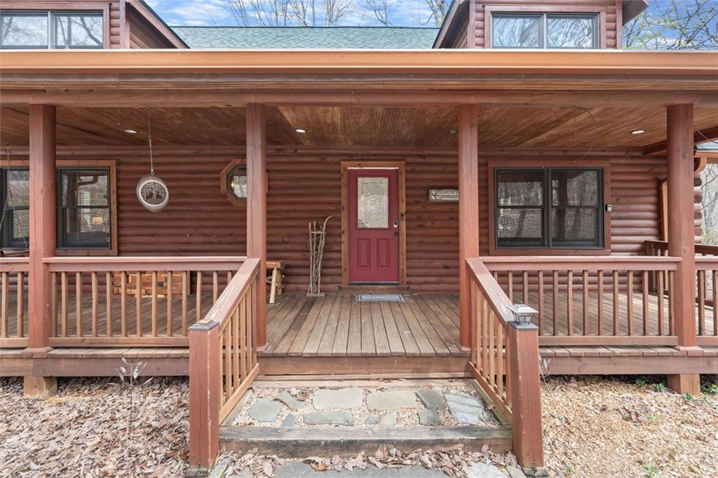 189 Frost Pine Circle Jasper, GA 30143 - Photo 4 of 42 a view of a brick house with wooden floor and a bench