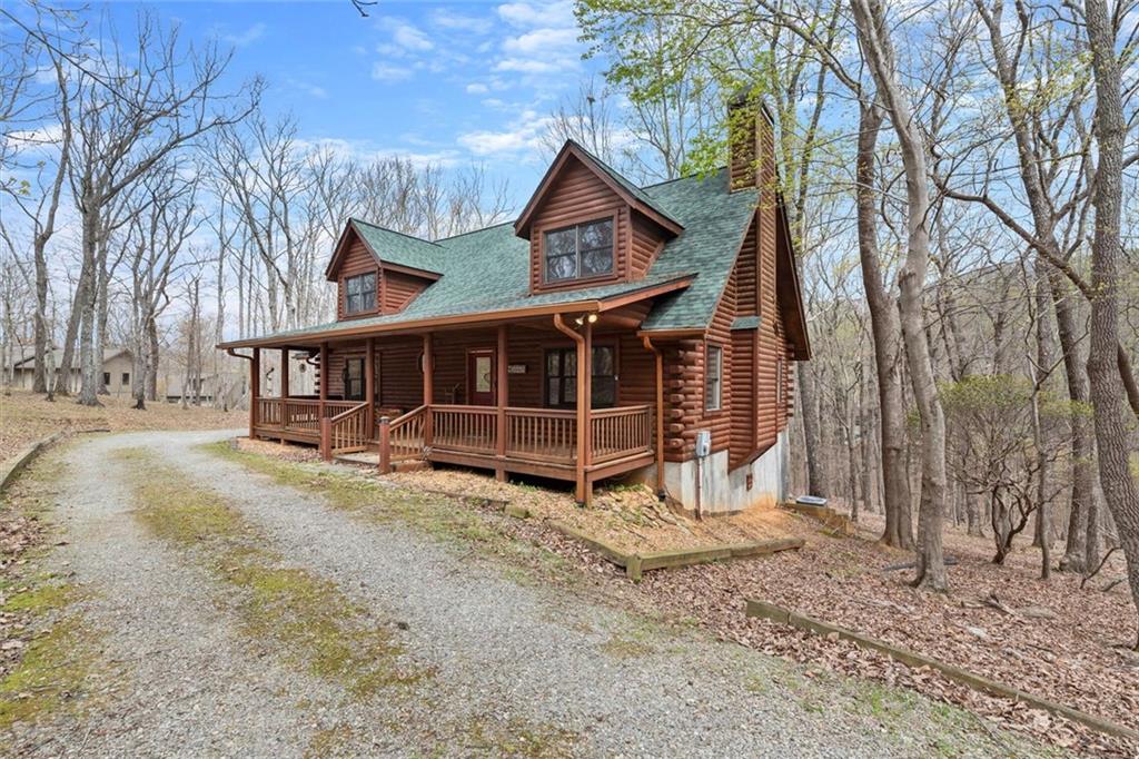 189 Frost Pine Circle Jasper, GA 30143 - Photo 5 of 42 a view of a house with a yard and wooden fence