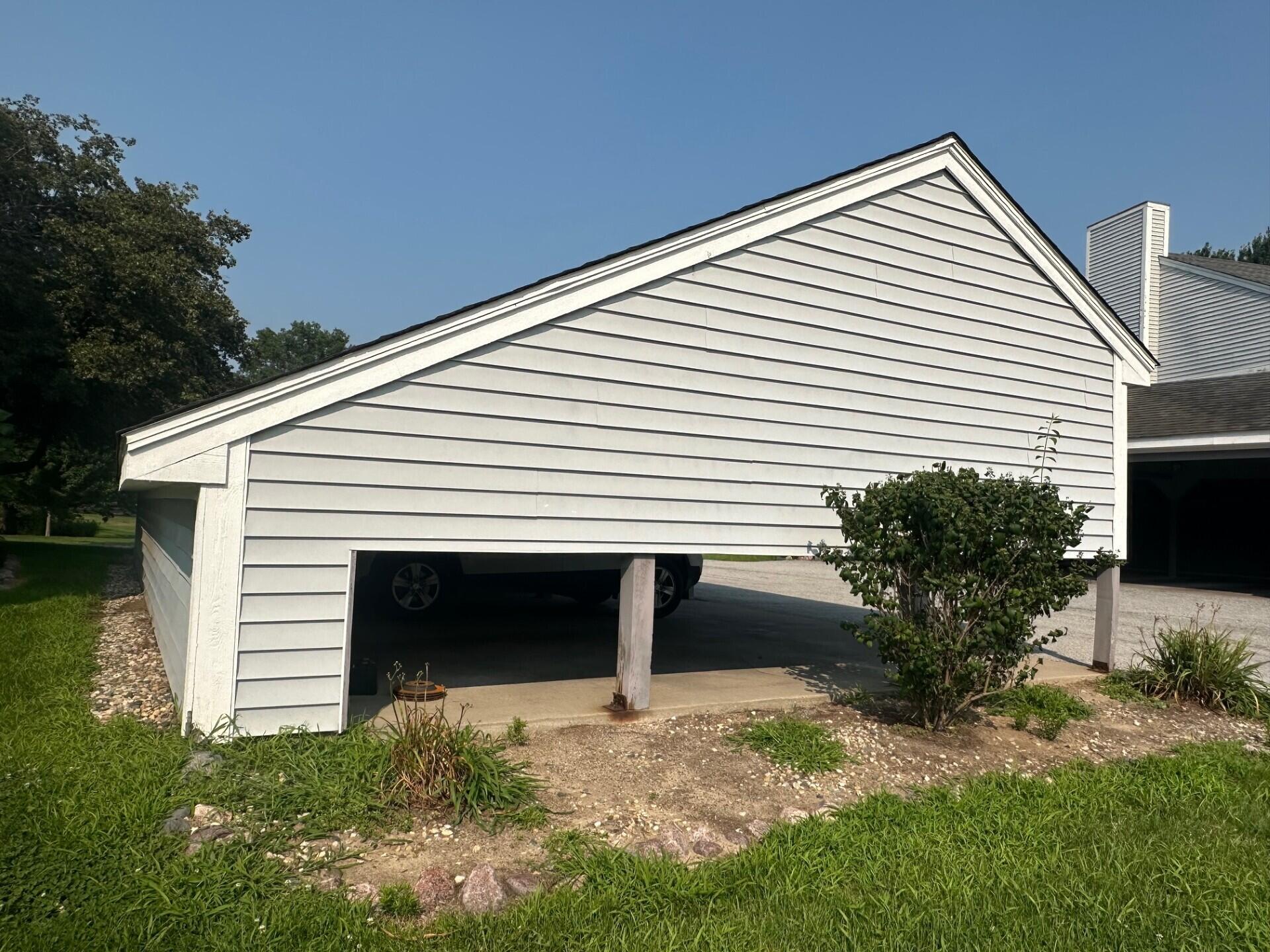 1079 Millpond Road, Unit A Valparaiso, IN 46385 - Photo 11 of 14 a view of a house with a yard and potted plants