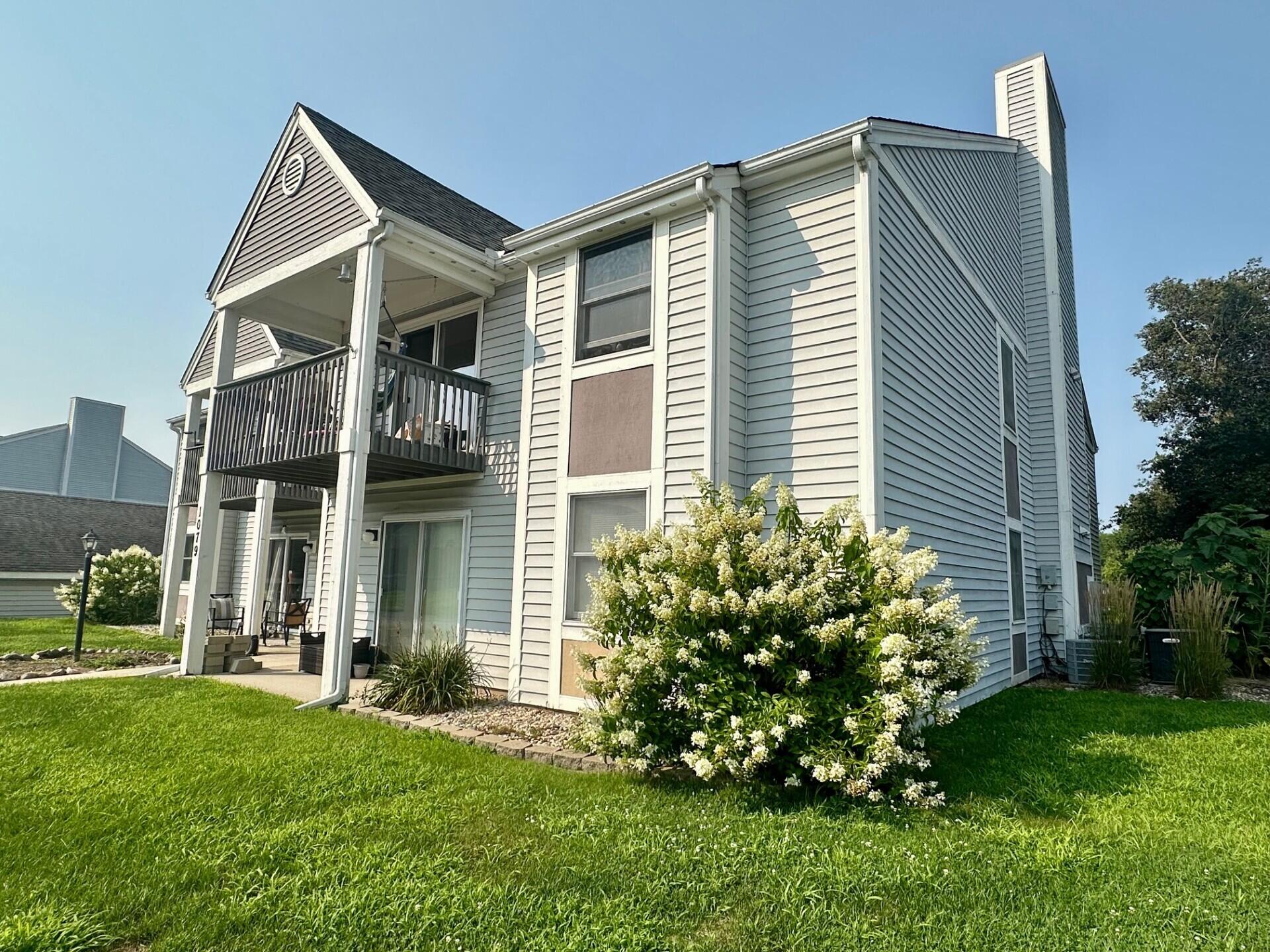 1079 Millpond Road, Unit A Valparaiso, IN 46385 - Photo 14 of 14 a front view of a house with a yard and trees