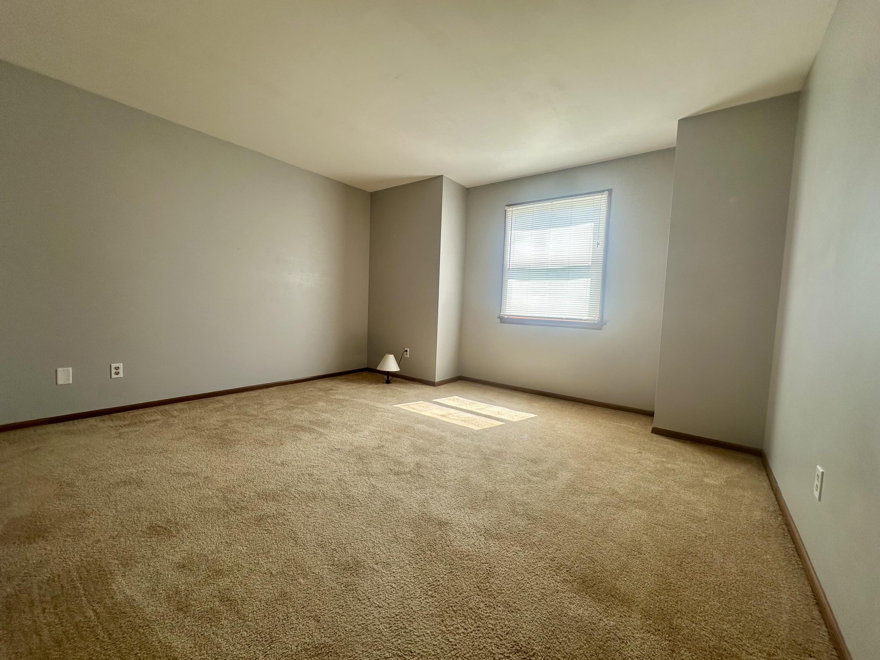 1079 Millpond Road, Unit A Valparaiso, IN 46385 - Photo 7 of 14 an empty room with a window
