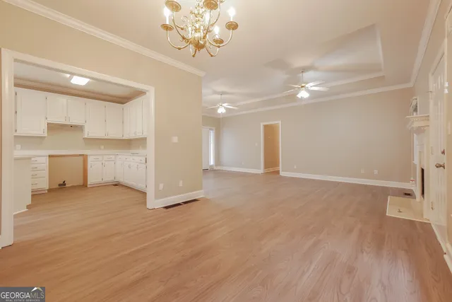 a view of a kitchen with a dishwasher and cabinets