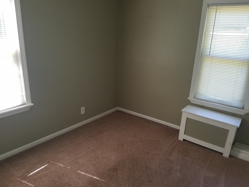 52 Stuart Street Springfield, MA 01109 - Photo 13 of 14 an empty room with a window