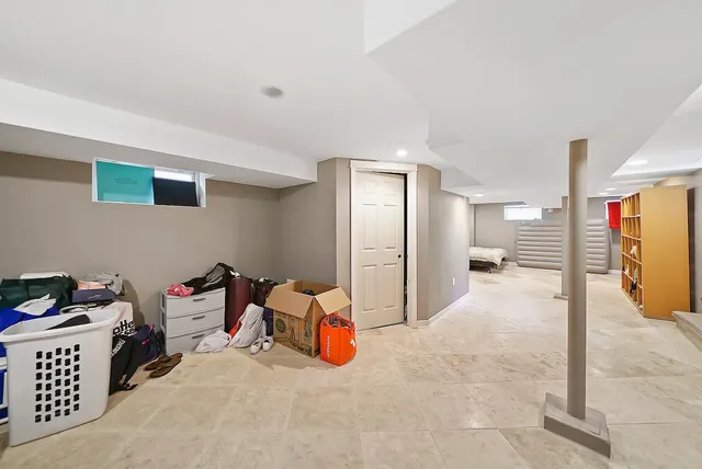 a bed room with furniture and gym equipment