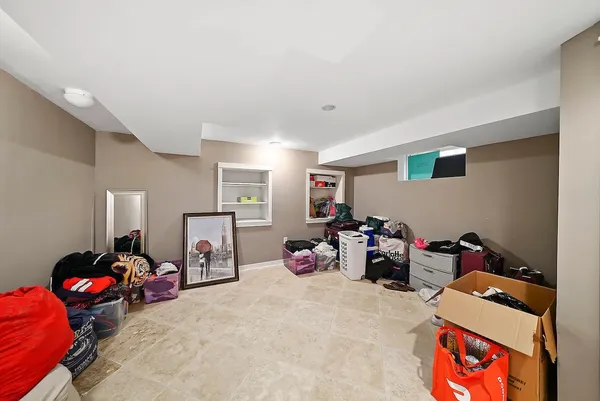 a bedroom with furniture and a book shelf