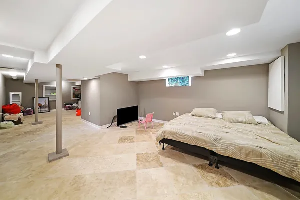 a bathroom with a shower a toilet and a sink