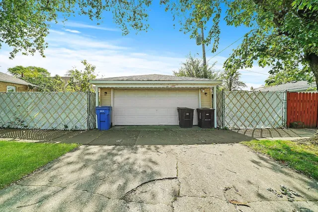 a front view of house with yard and trees