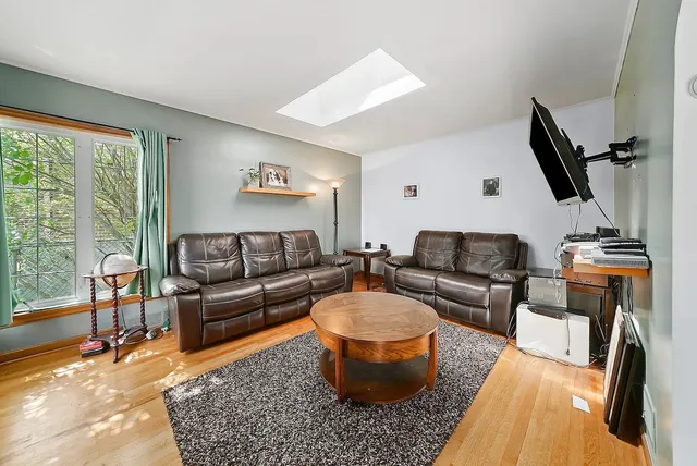 a living room with furniture and a rug