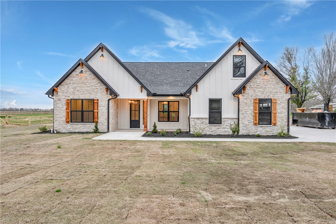 4554 Flat Rock Road Iva, SC 29655 - Photo 6 of 32 A charming blend of stone and board-and-batten siding creates a modern farmhouse aesthetic.