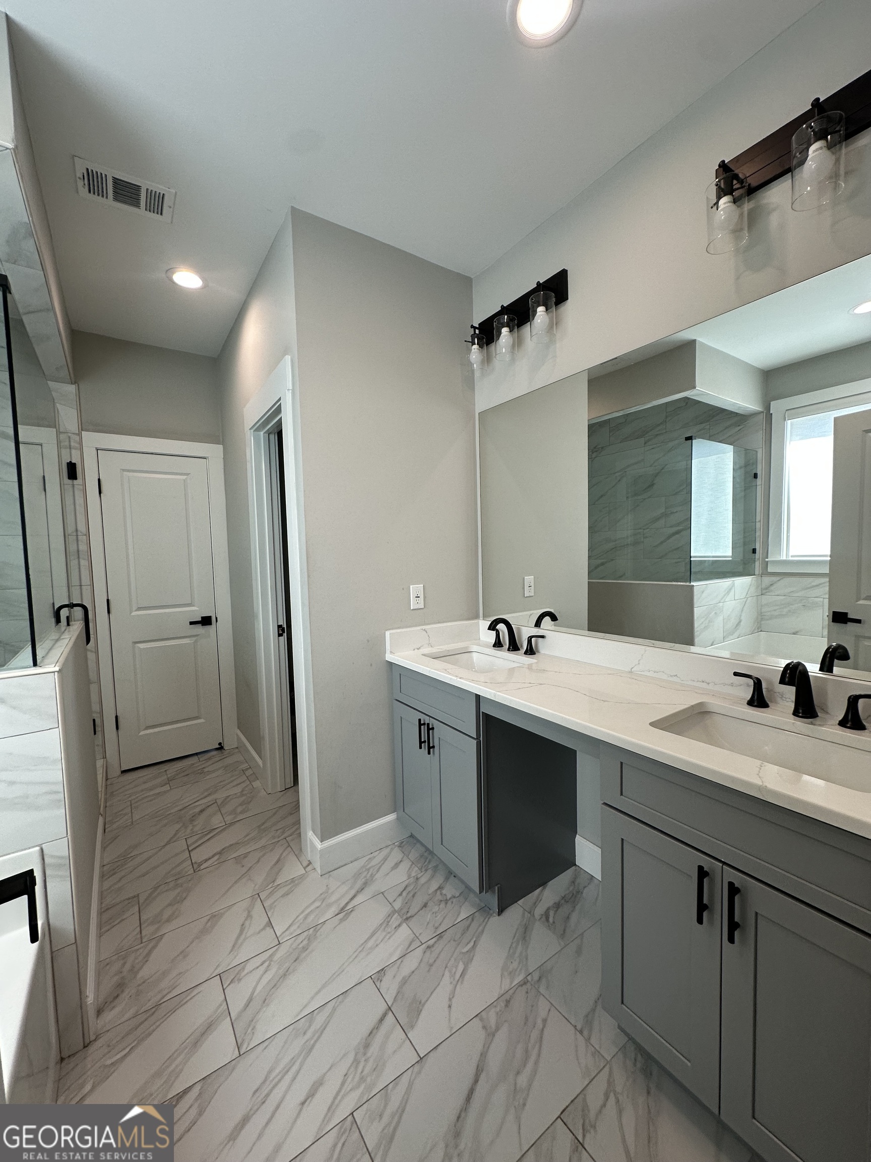 506 Summit View Drive Jefferson, GA 30549 - Photo 14 of 52 a spacious bathroom with a double vanity sink mirror and shower