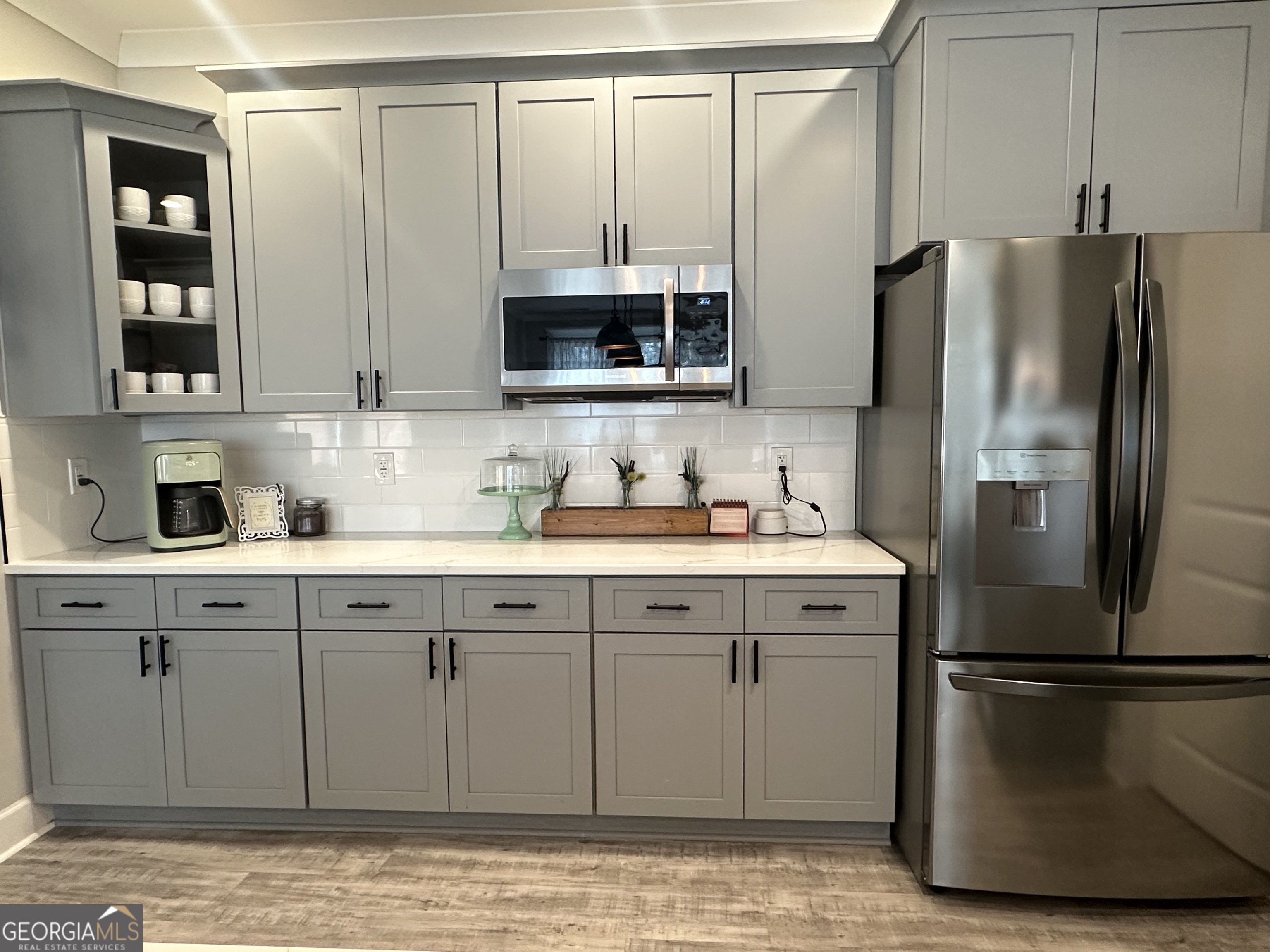 506 Summit View Drive Jefferson, GA 30549 - Photo 27 of 52 a kitchen with a refrigerator sink and cabinets