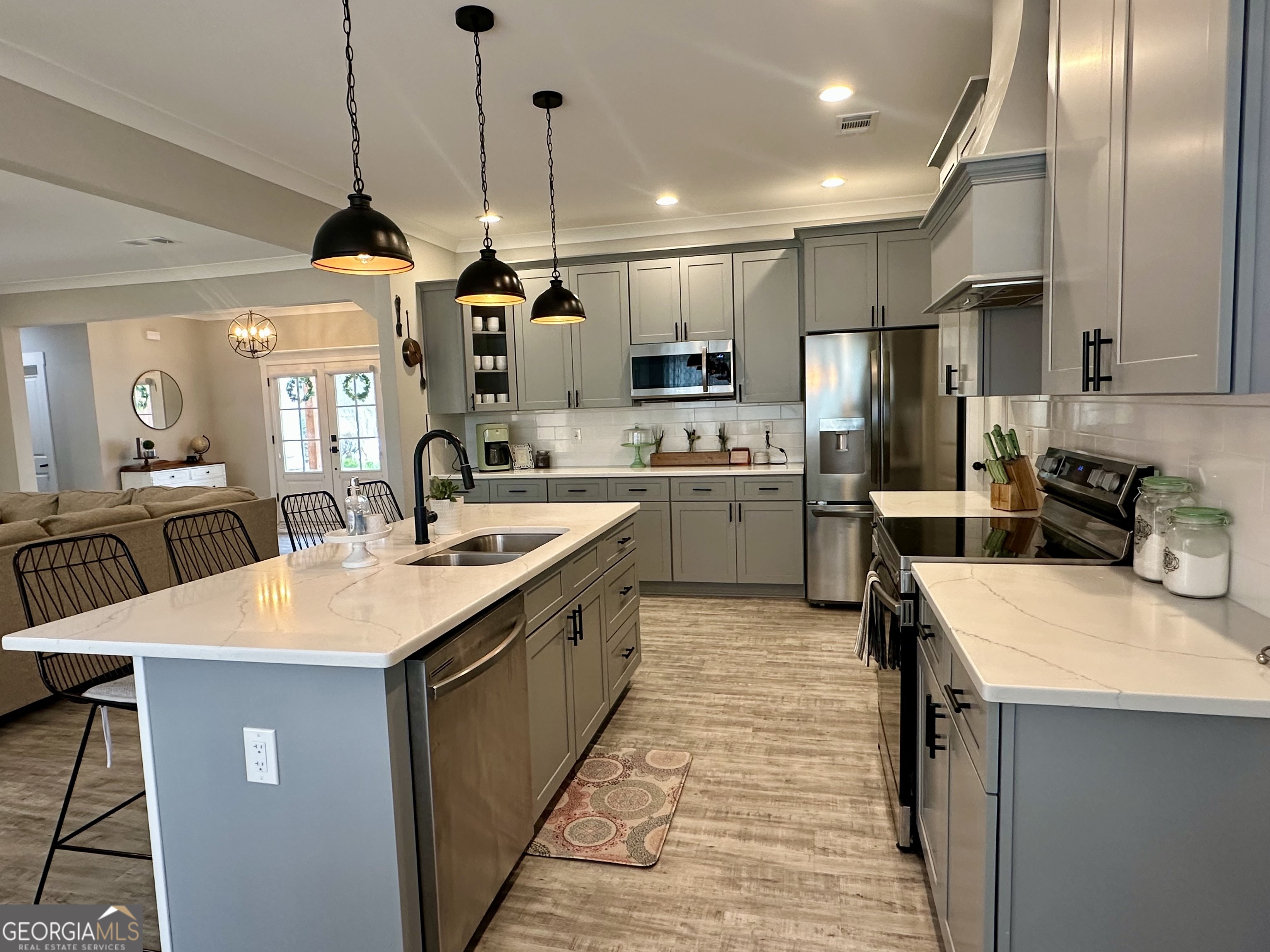 506 Summit View Drive Jefferson, GA 30549 - Photo 28 of 52 a kitchen with stainless steel appliances kitchen island granite countertop a sink a stove and a refrigerator