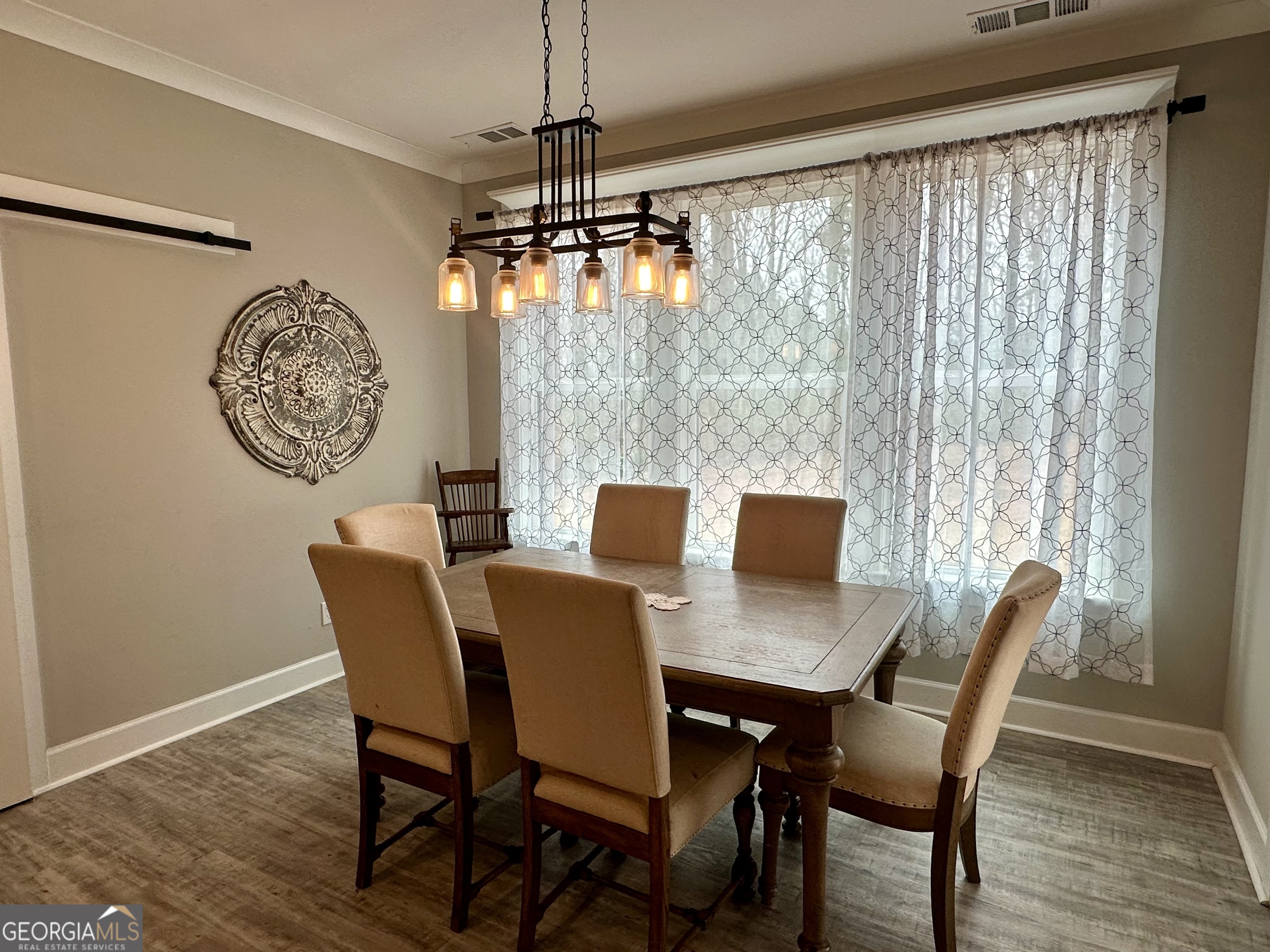 506 Summit View Drive Jefferson, GA 30549 - Photo 29 of 52 a view of a dining room with furniture window and wooden floor
