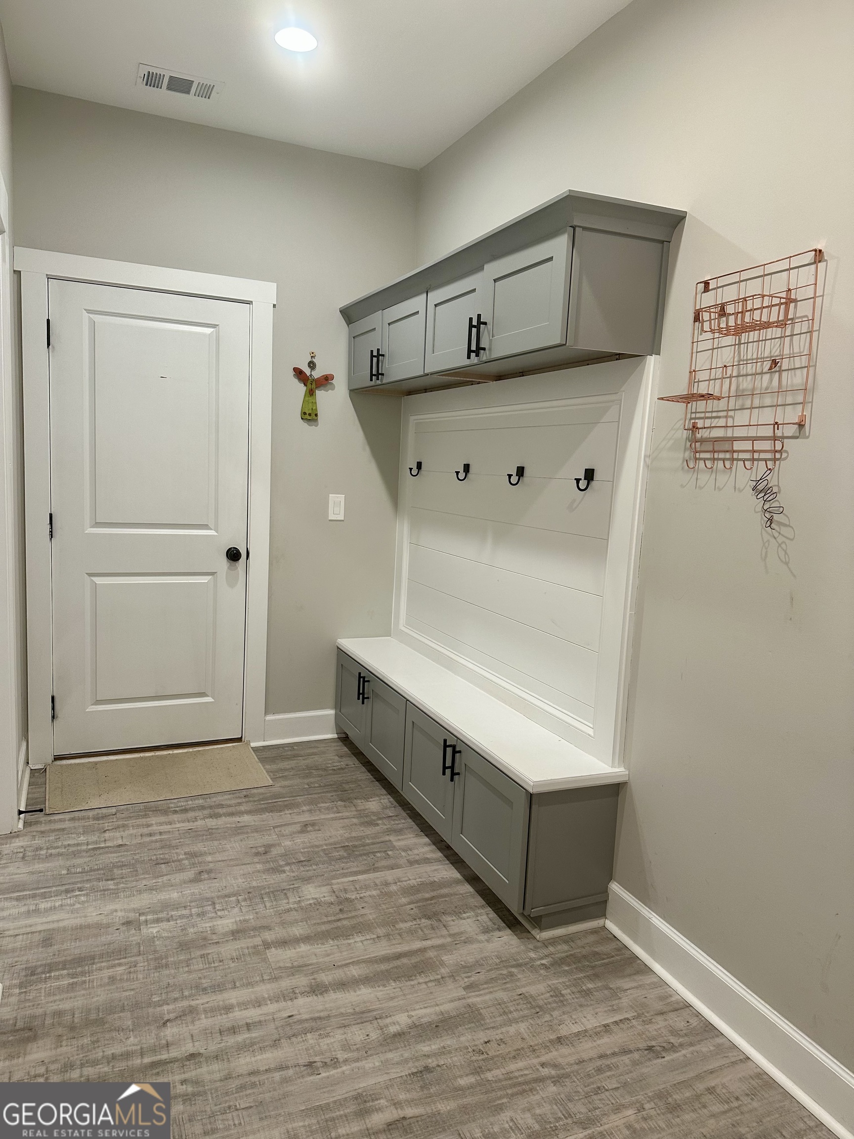 506 Summit View Drive Jefferson, GA 30549 - Photo 32 of 52 a room with wooden floor and white walls