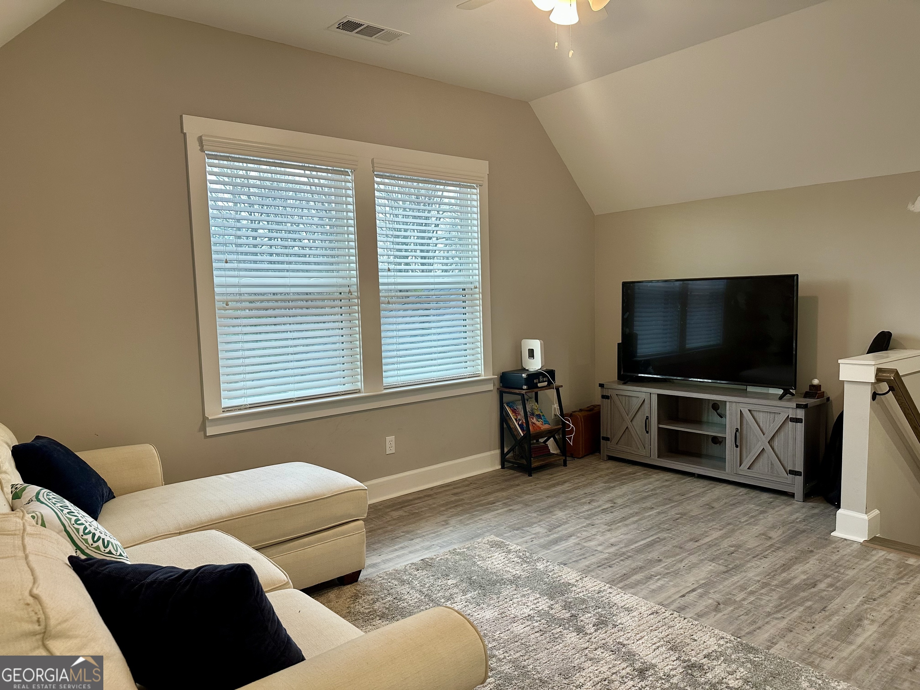 506 Summit View Drive Jefferson, GA 30549 - Photo 35 of 52 a living room with furniture and a flat screen tv