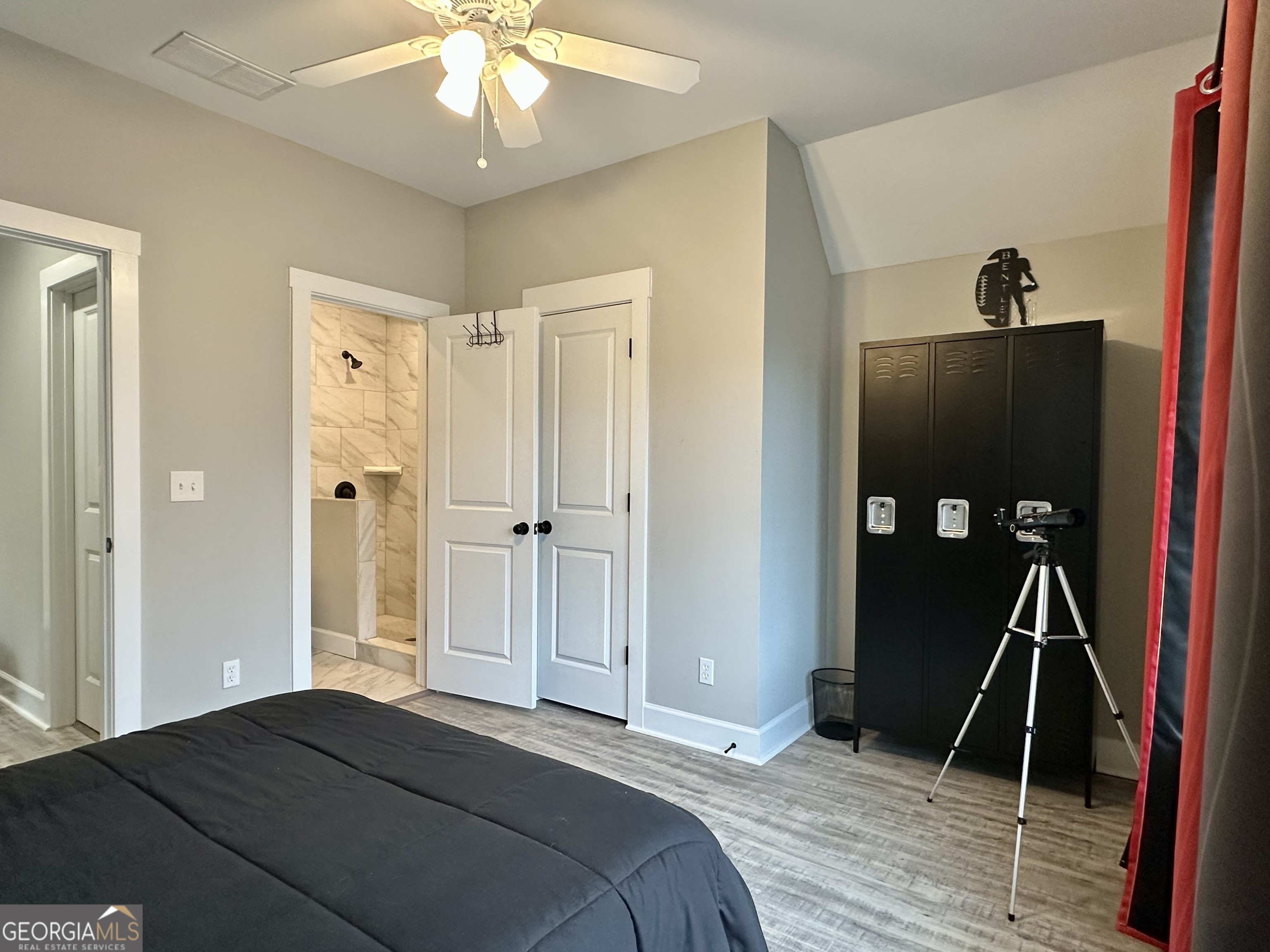 506 Summit View Drive Jefferson, GA 30549 - Photo 37 of 52 a bedroom with a bed and a chandelier
