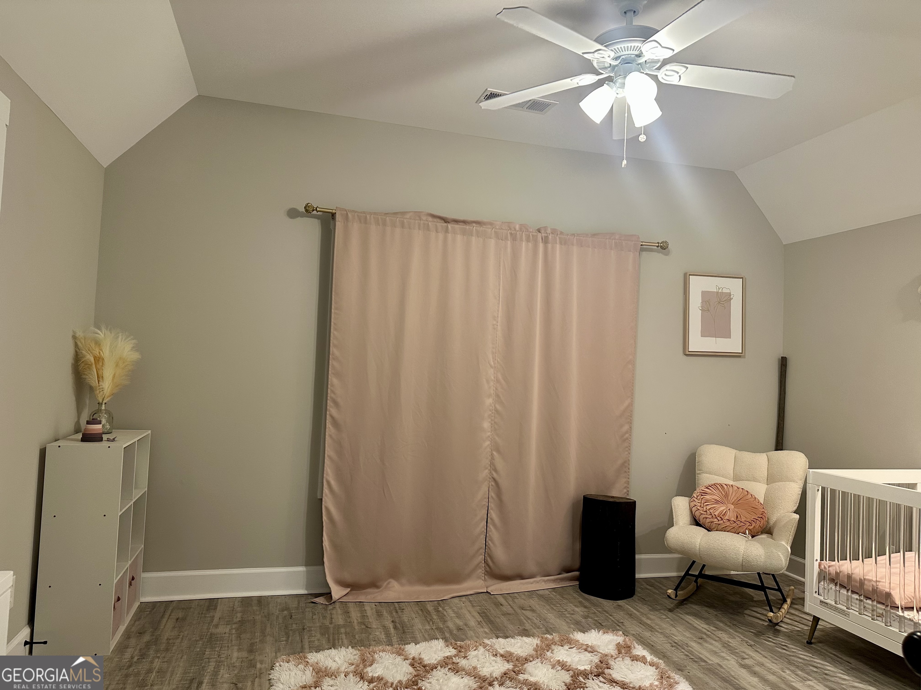 506 Summit View Drive Jefferson, GA 30549 - Photo 44 of 52 a bedroom with a bed and a chandelier fan
