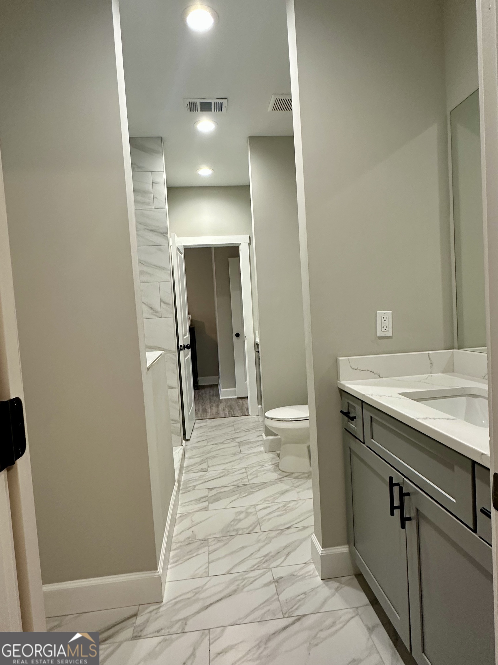506 Summit View Drive Jefferson, GA 30549 - Photo 46 of 52 a bathroom with a sink and a mirror