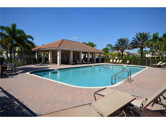 415 Southwest Walking Path Stuart, FL 34997 - Photo 13 of 16 a view of a swimming pool with a yard