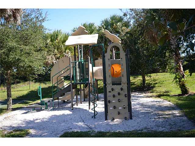 415 Southwest Walking Path Stuart, FL 34997 - Photo 15 of 16 a view of outdoor space garden and patio