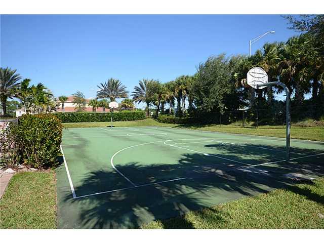415 Southwest Walking Path Stuart, FL 34997 - Photo 16 of 16 a view of a golf course with a lake