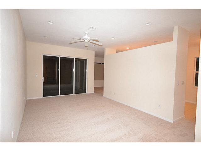 415 Southwest Walking Path Stuart, FL 34997 - Photo 2 of 16 a view of an empty room with chandelier fan