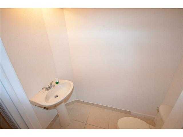 415 Southwest Walking Path Stuart, FL 34997 - Photo 6 of 16 a bathroom with a sink and a mirror