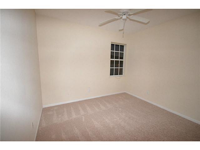 415 Southwest Walking Path Stuart, FL 34997 - Photo 10 of 16 a view of an empty room with a window