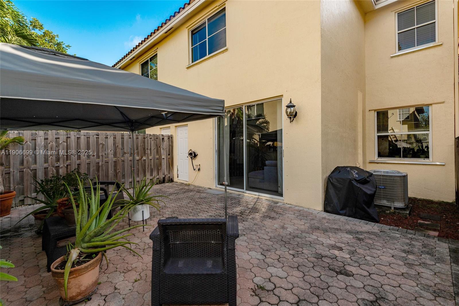 3816 Southwest 169th Terrace Miramar, FL 33027 - Photo 12 of 21 a living room with a couch and a potted plant