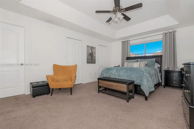 a bedroom with furniture and a lamp