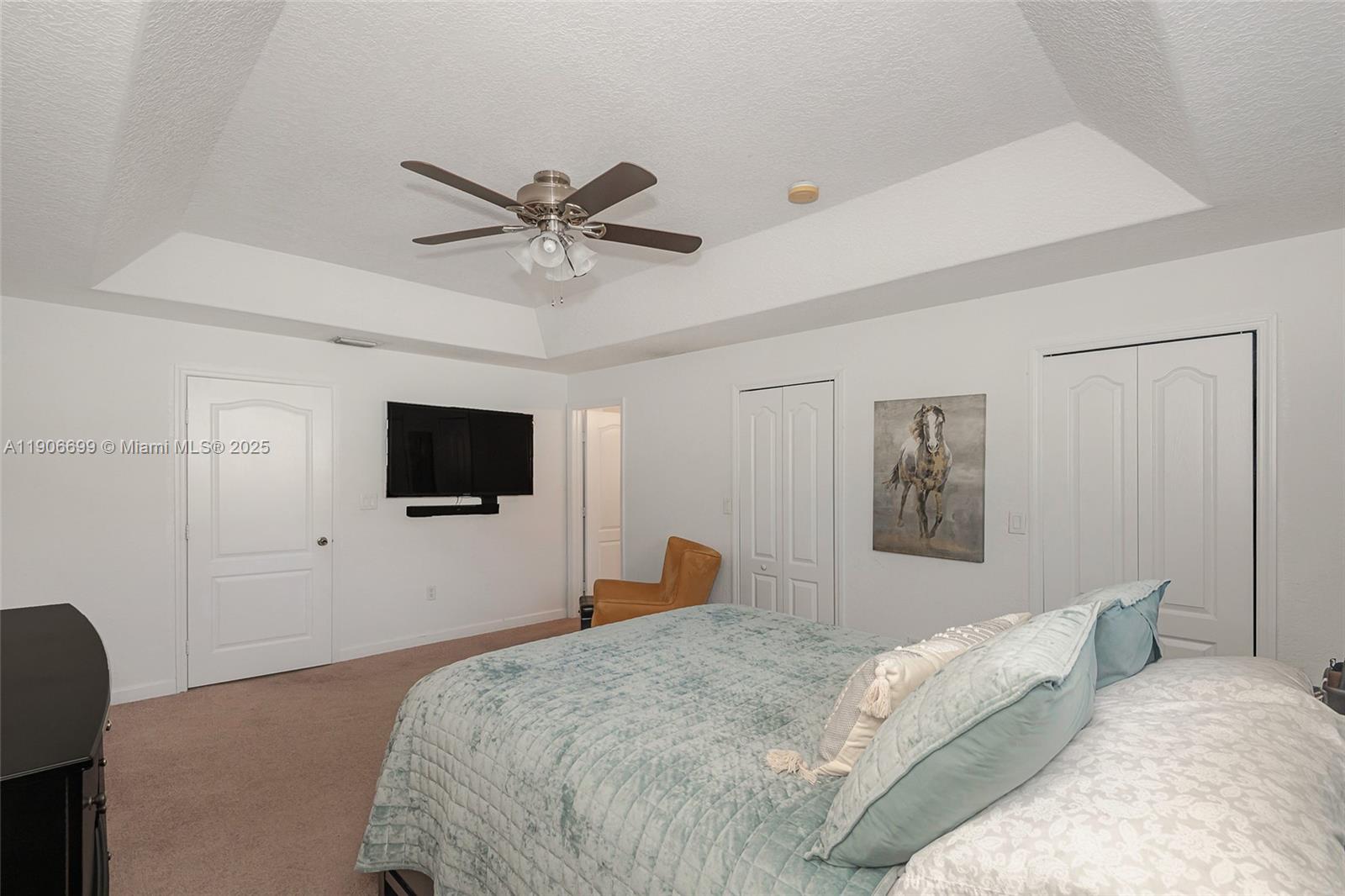 3816 Southwest 169th Terrace Miramar, FL 33027 - Photo 17 of 21 a bedroom with a bed and a flat screen tv