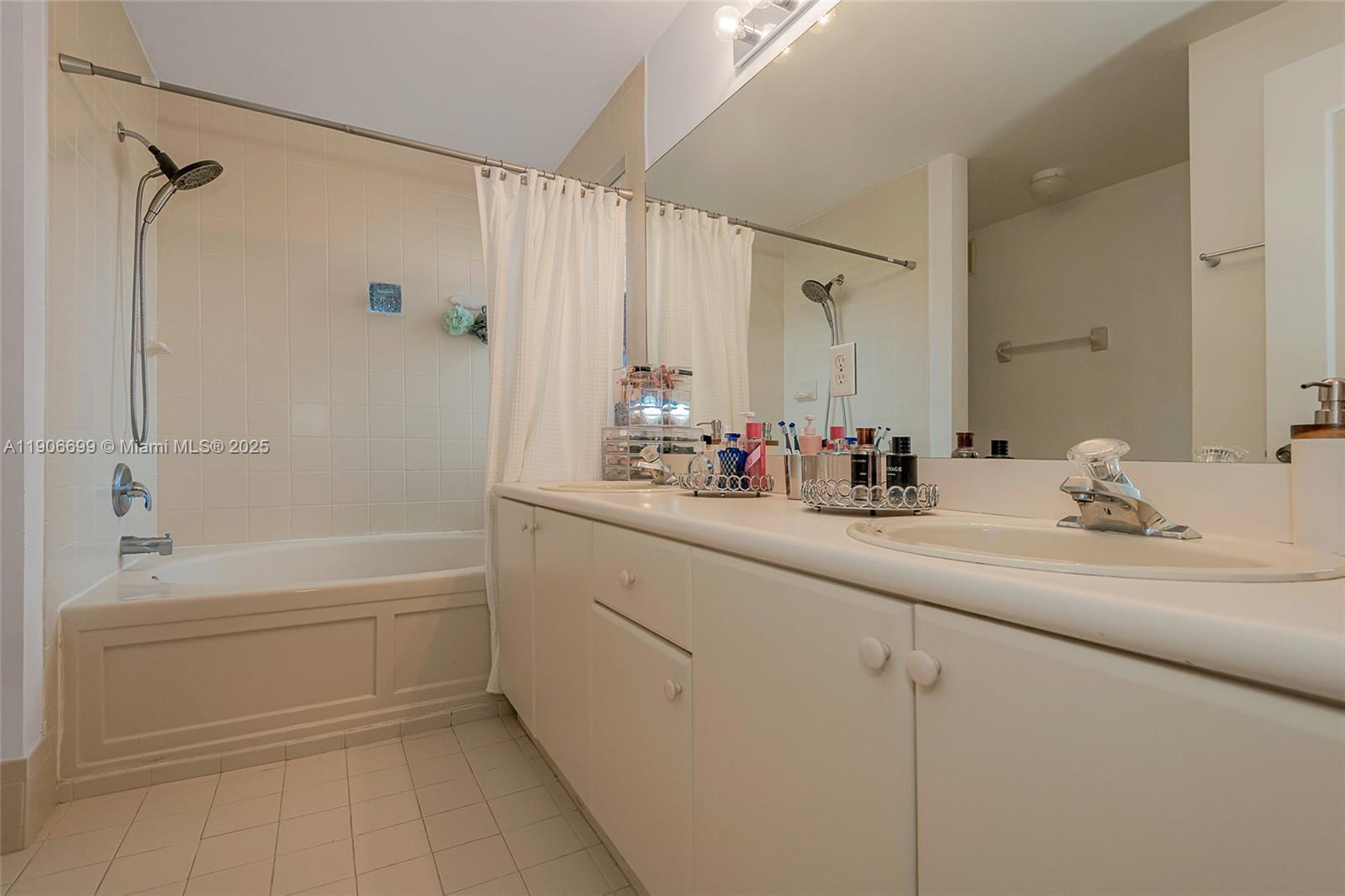 3816 Southwest 169th Terrace Miramar, FL 33027 - Photo 18 of 21 a bathroom with a bathtub and a sink