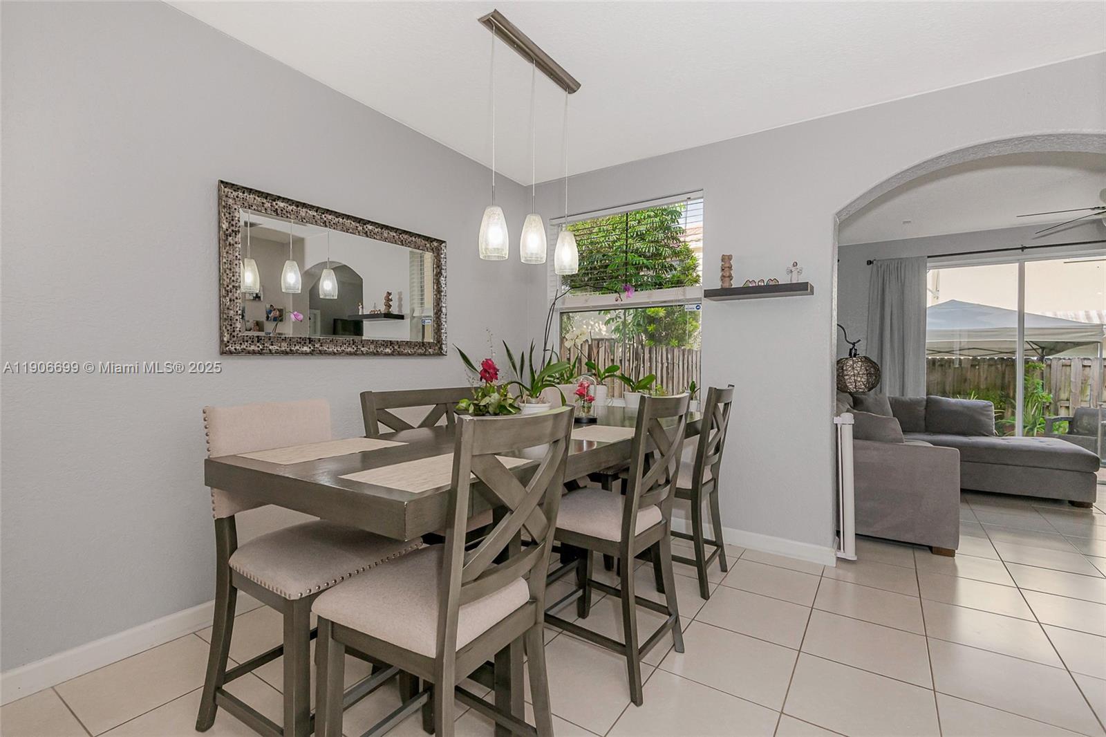 3816 Southwest 169th Terrace Miramar, FL 33027 - Photo 4 of 21 a view of a dining room with furniture and a large window