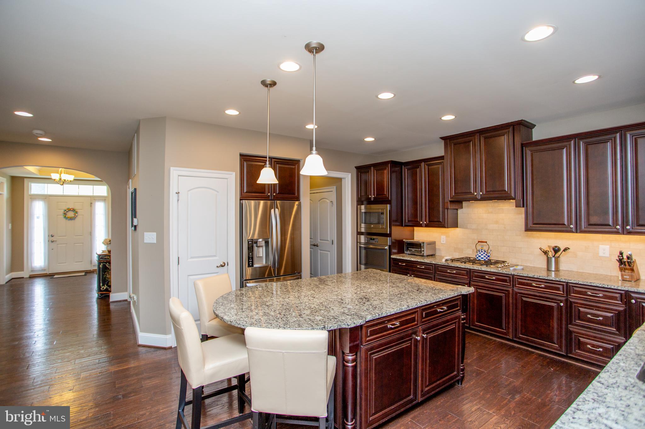 4682 Plough Tavern Road Doylestown, PA 18902 - Photo 13 of 42 a kitchen with a stove a sink and a refrigerator