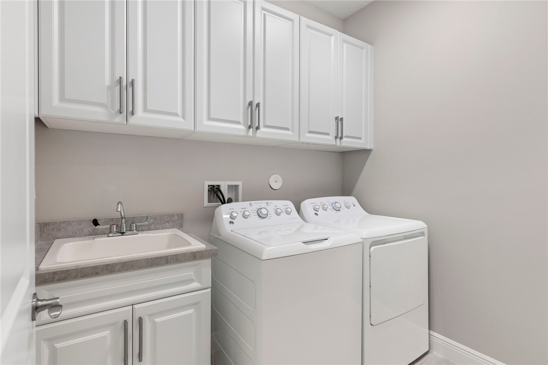 7203 33rd Square Vero Beach, FL 32967 - Photo 17 of 28 a utility room with dryer and washer