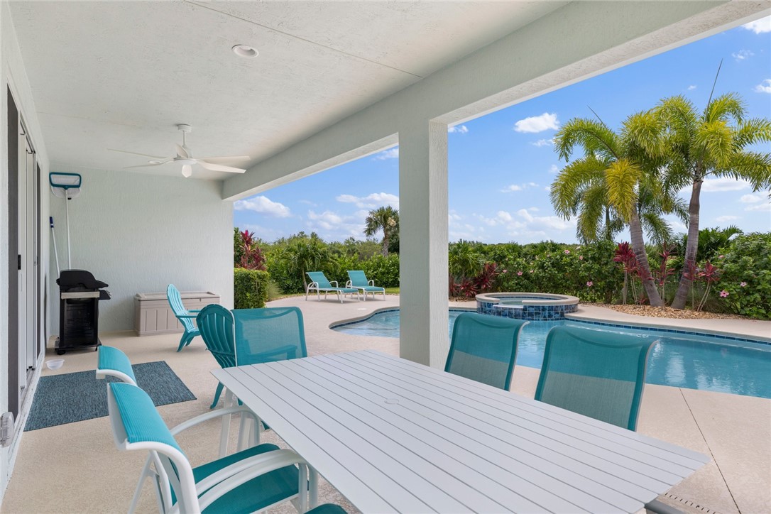 7203 33rd Square Vero Beach, FL 32967 - Photo 19 of 28 a view of a dining room with furniture window and outer view