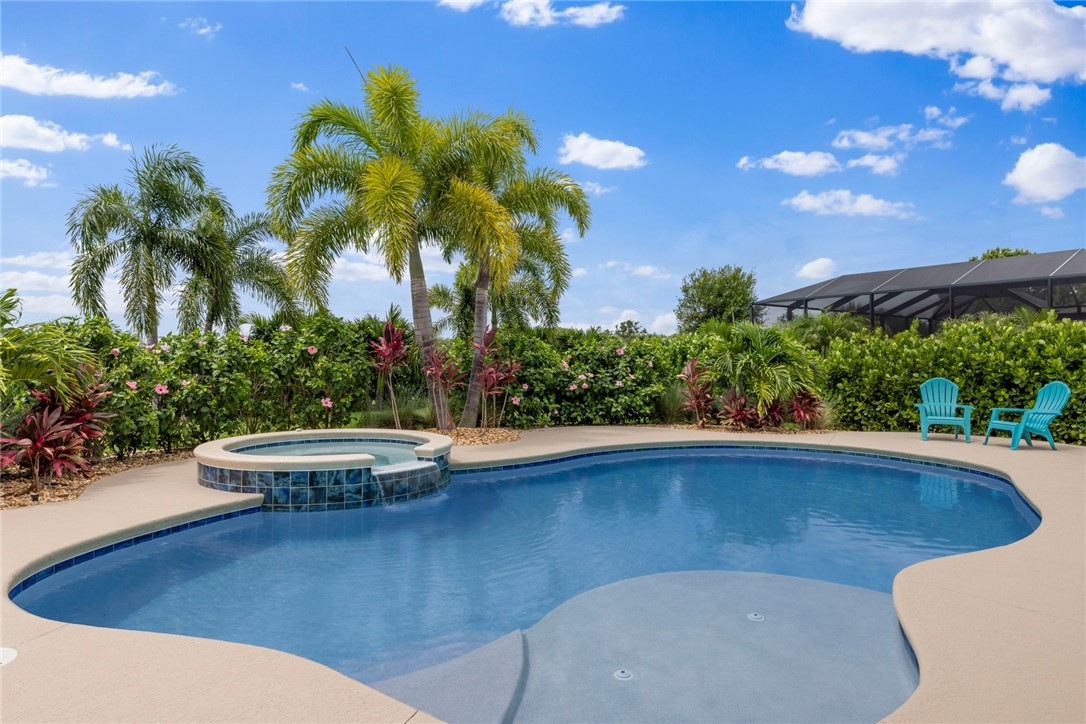 7203 33rd Square Vero Beach, FL 32967 - Photo 23 of 28 a view of outdoor space yard swimming pool and patio