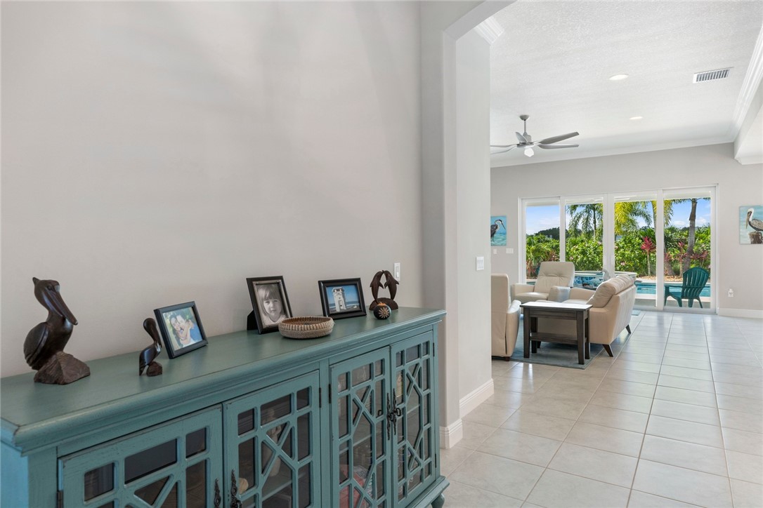 7203 33rd Square Vero Beach, FL 32967 - Photo 3 of 28 a living room with furniture and a large window